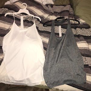 two white and gray gym shirts